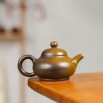 Xiaomilai (about 110cc) naked-fired with natural plant ash glaze, golden tea foam effect, entirely handmade Ni Xing pottery